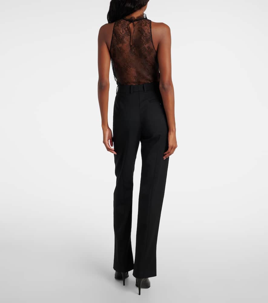 Alexander Mcqueen Tailored Wool Trousers Featuring Flared Hem In Black