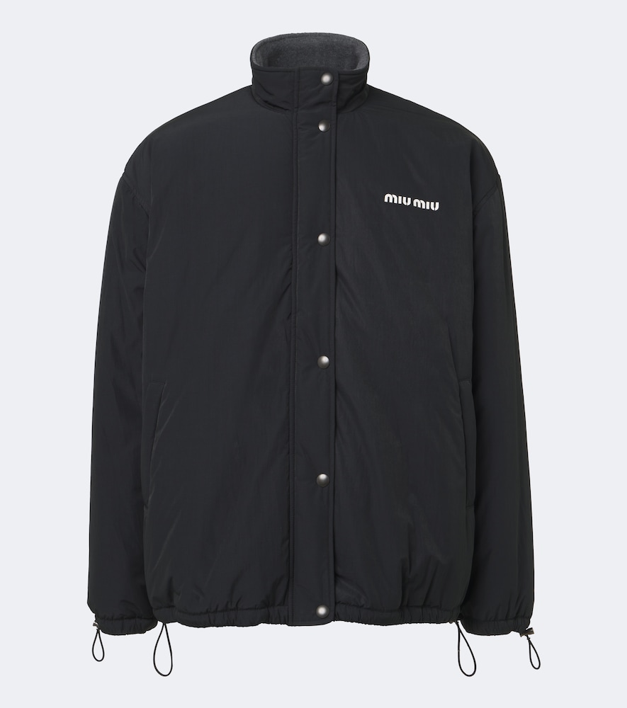 Miu Miu Veste technique logo 2980$