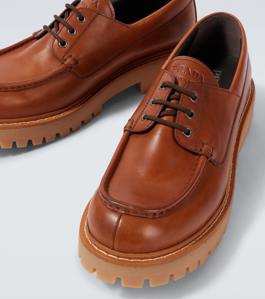 Prada Leather Loafers With Embossed-logo In Brown