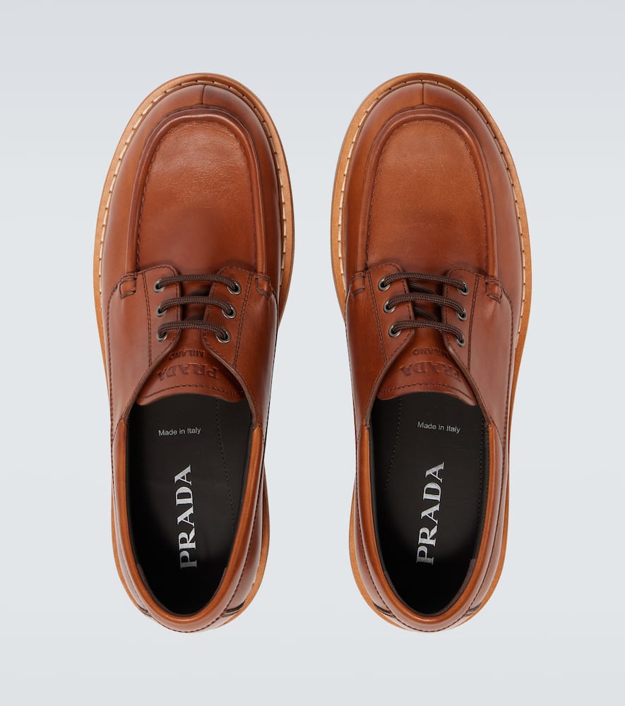 Prada Leather Loafers With Embossed-logo In Brown