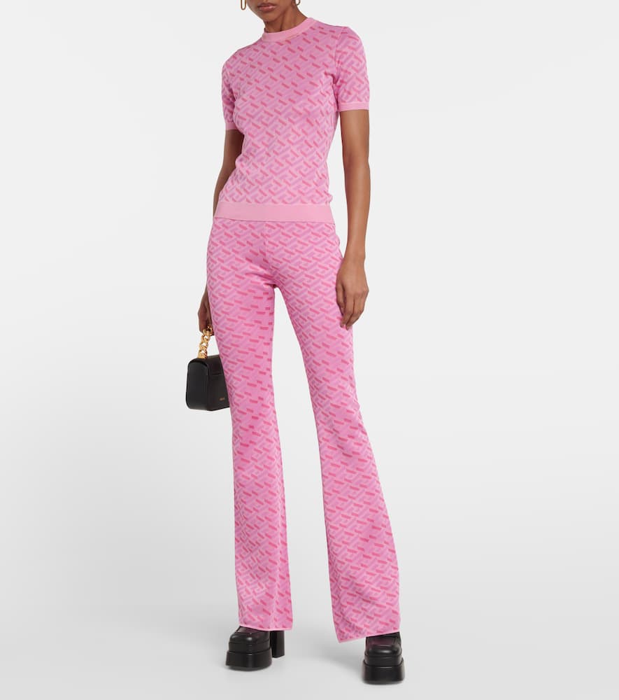 Shop Versace La Greca Jacquard Silk-blend Flared Pants In Pink+fuxia