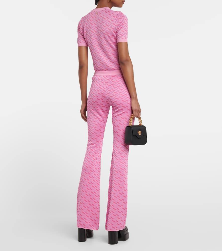 Shop Versace La Greca Jacquard Silk-blend Flared Pants In Pink+fuxia