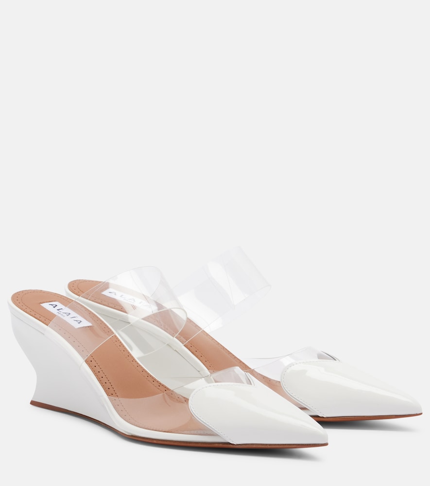 Alaïa Mules Le Coeur in vernice con zeppa