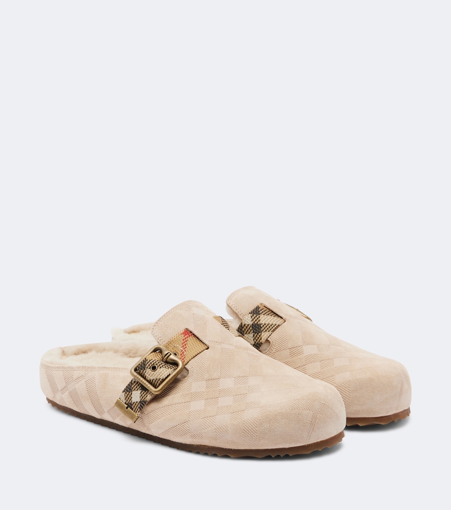 Burberry Mules Urchin en daim et shearling 695 €