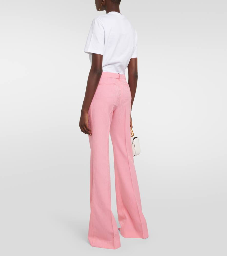 Shop Versace Allover Flared Wool Pants In Pink