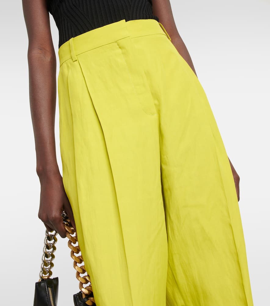 Shop Stella Mccartney Pleated Tapered Linen-blend Pants In Lime