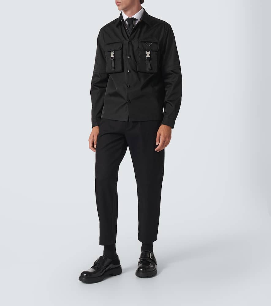Prada Triangle-logo Tapered-leg Jeans In Black