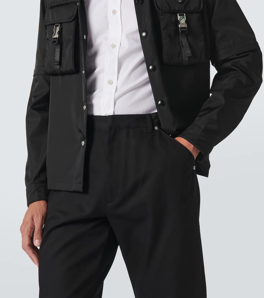Prada Triangle-logo Tapered-leg Jeans In Black