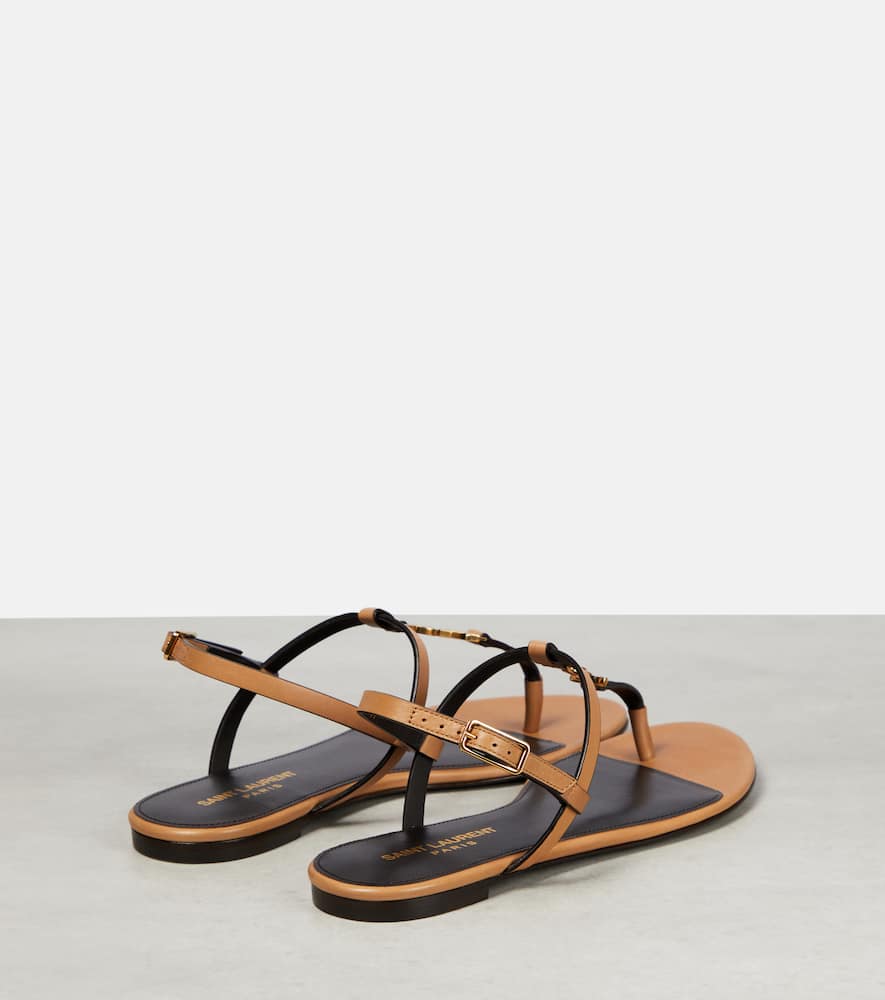 Shop Saint Laurent Cassandra Leather Thong Sandals In Gold Brown