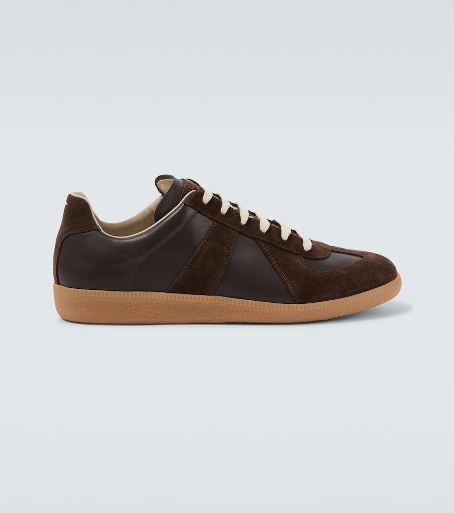 Maison Margiela Baskets Replica en cuir et daim 620 €