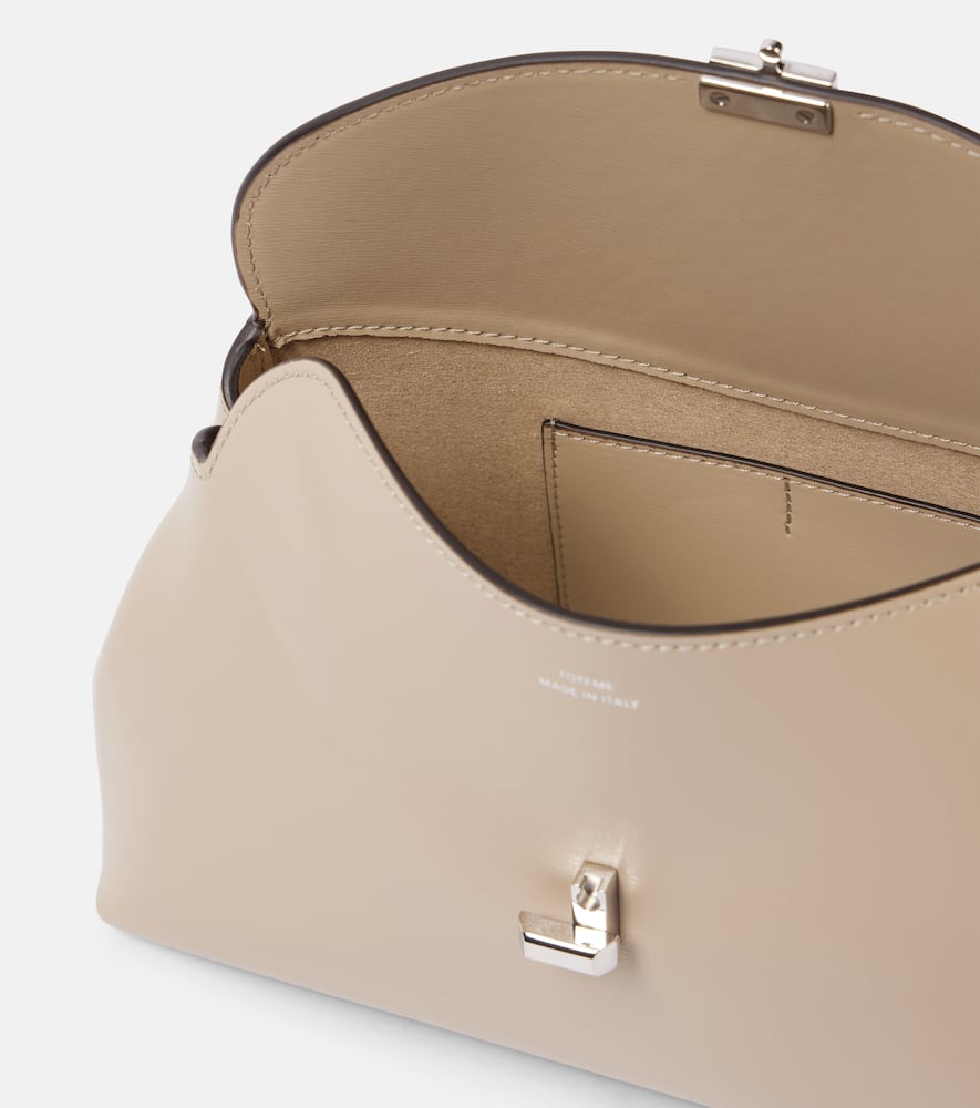 Totême T-lock Leather Clutch In Beige