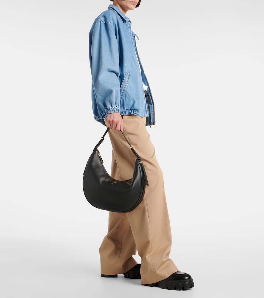 Prada Rounded Shoulder Bag With Gold-tone Hardware In Black