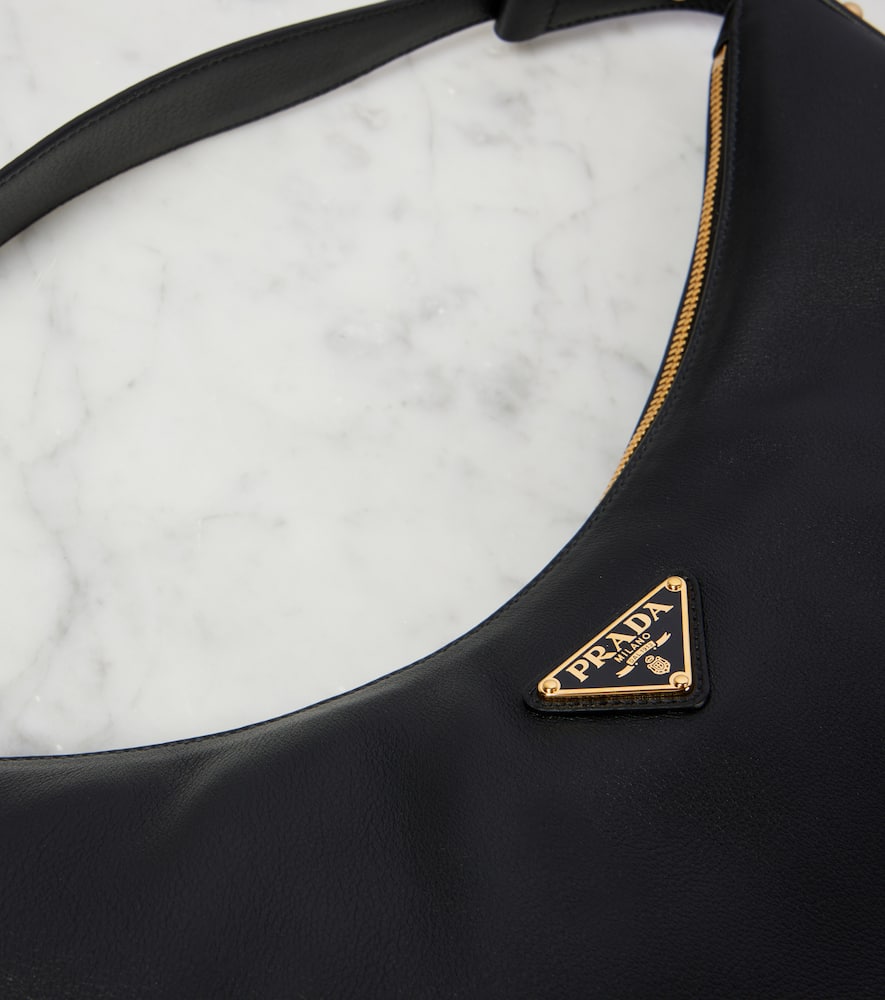 Prada Rounded Shoulder Bag With Gold-tone Hardware In Black