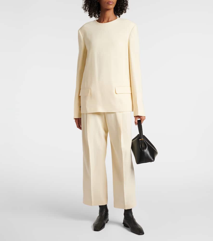 Totême Pleated Low-rise Straight Pants In Yellow