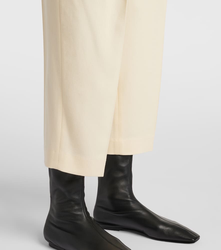 Totême Pleated Low-rise Straight Pants In Yellow