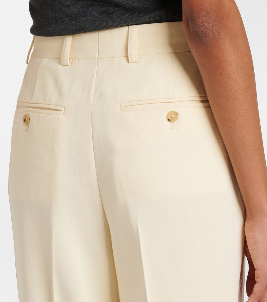 Totême Pleated Low-rise Straight Pants In Yellow