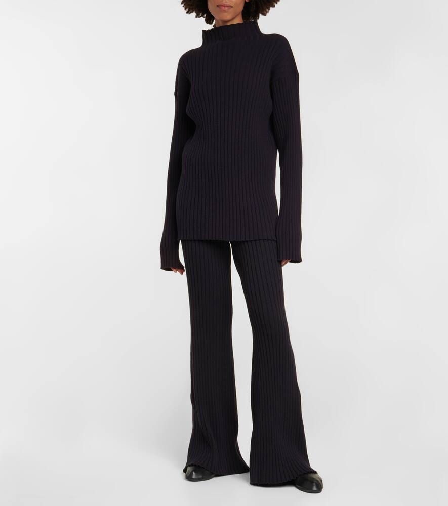 Shop The Row Bija Cashmere Flared Pants In Navy /blackwood