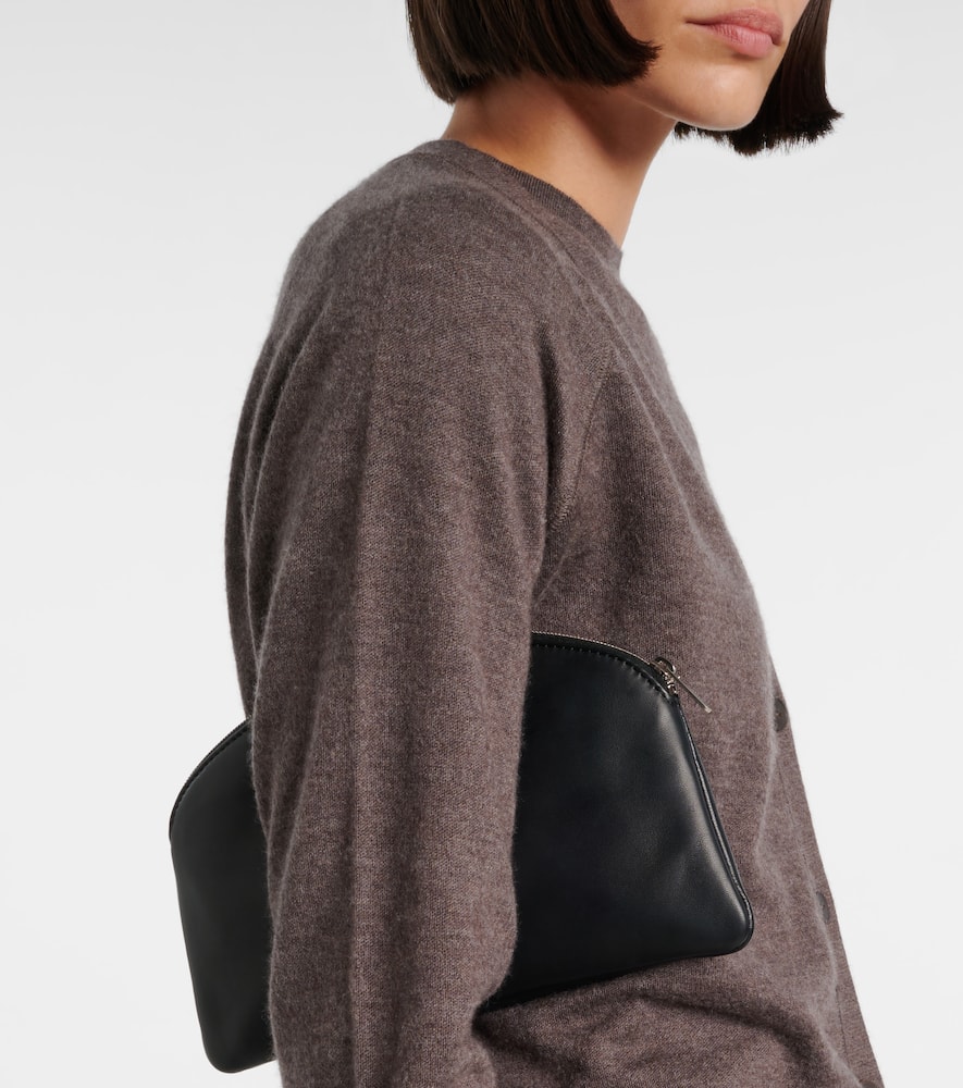 The Row Round Leather Coin Purse In Black