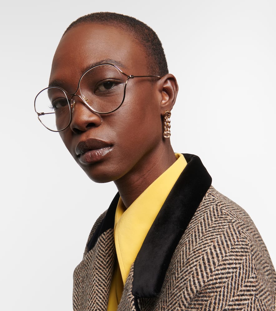 Shop Gucci Round Glasses In Gold