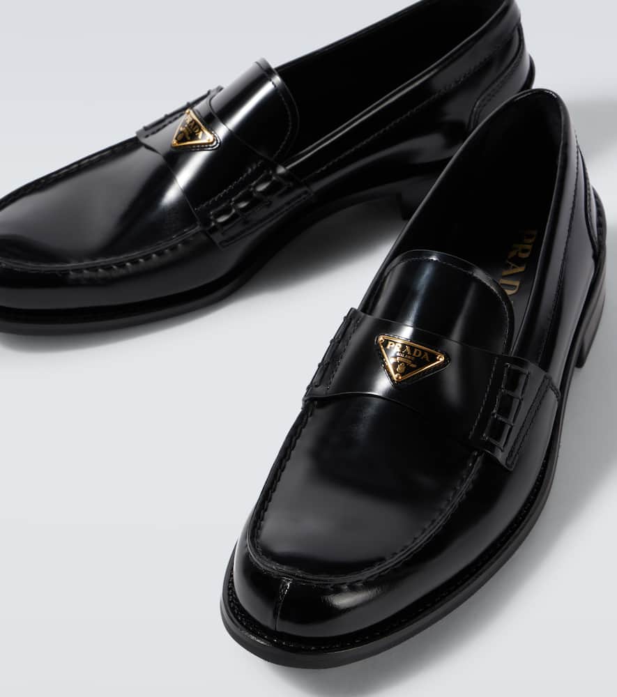 Prada Triangular Plaque Loafers In Black