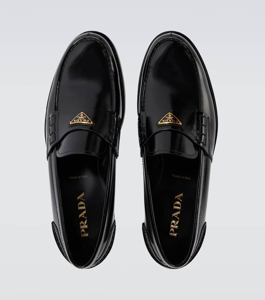 Prada Triangular Plaque Loafers In Black