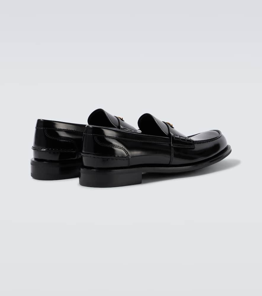 Prada Triangular Plaque Loafers In Black