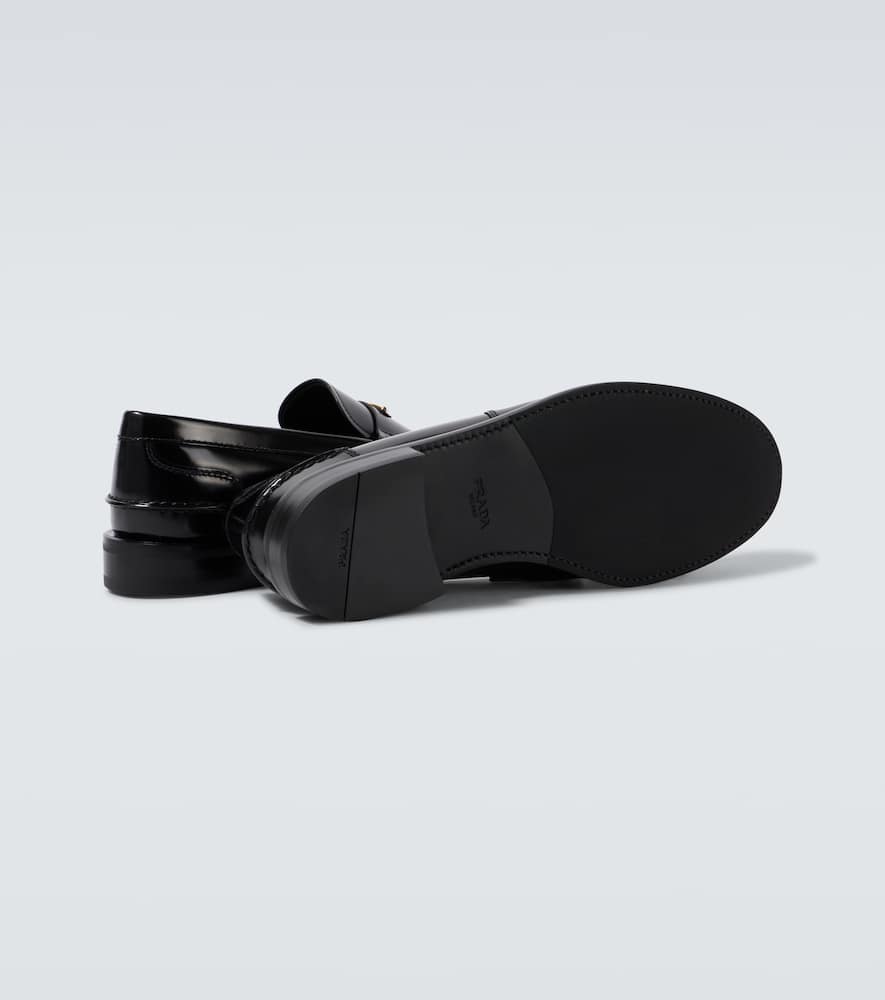 Prada Triangular Plaque Loafers In Black