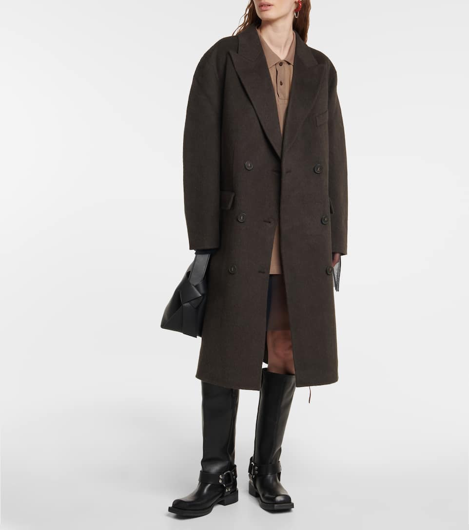 A masculine piece has been redefined as contemporarily feminine with this coat from Acne Studios. This oversized piece will shield you against the cold as it’s made from a blend of alpaca and wool.