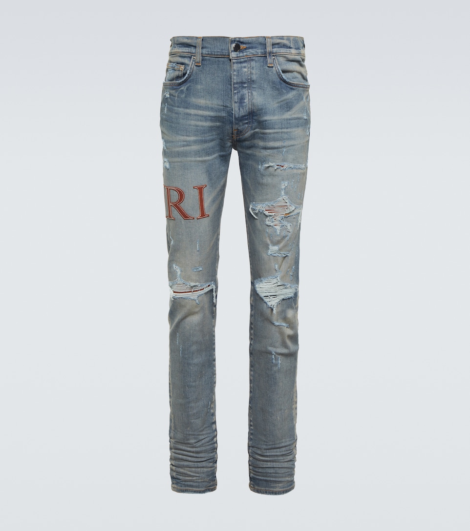 Amiri - Distressed skinny jeans | Mytheresa