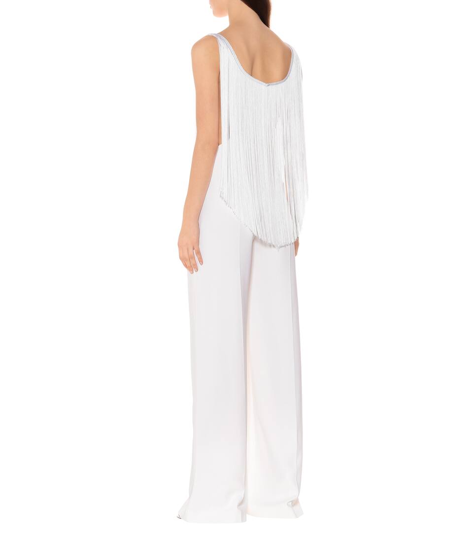 white jumpsuit with fringe