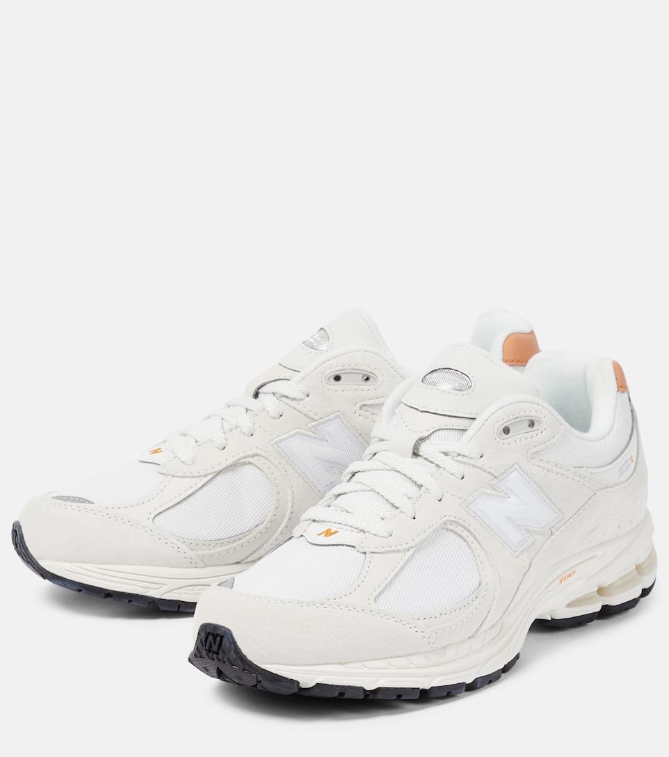 The latest 2002R sneakers from New Balance are a refresh on the running sneakers of the 2000s. Made from leather, the understated style has shock-absorbing midsoles and mesh uppers.