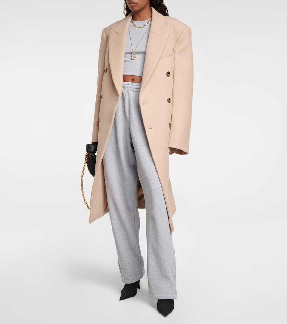 This sophisticated coat from Wardrobe.NYC will be in your wardrobe for years to come. Crafted from wool, the double-breasted silhouette boats peak lapels and flap pockets.