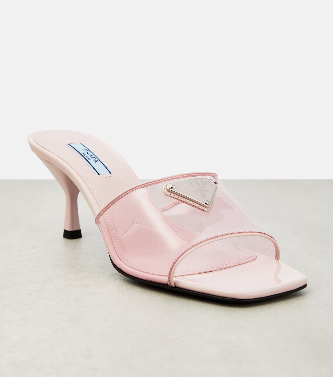 Leather Trimmed PVC Mules in Pink - Prada | Mytheresa