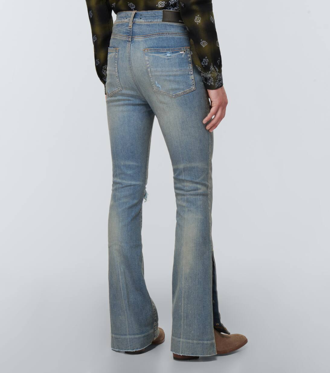 Distressed Flared Jeans in Blue Amiri Mytheresa