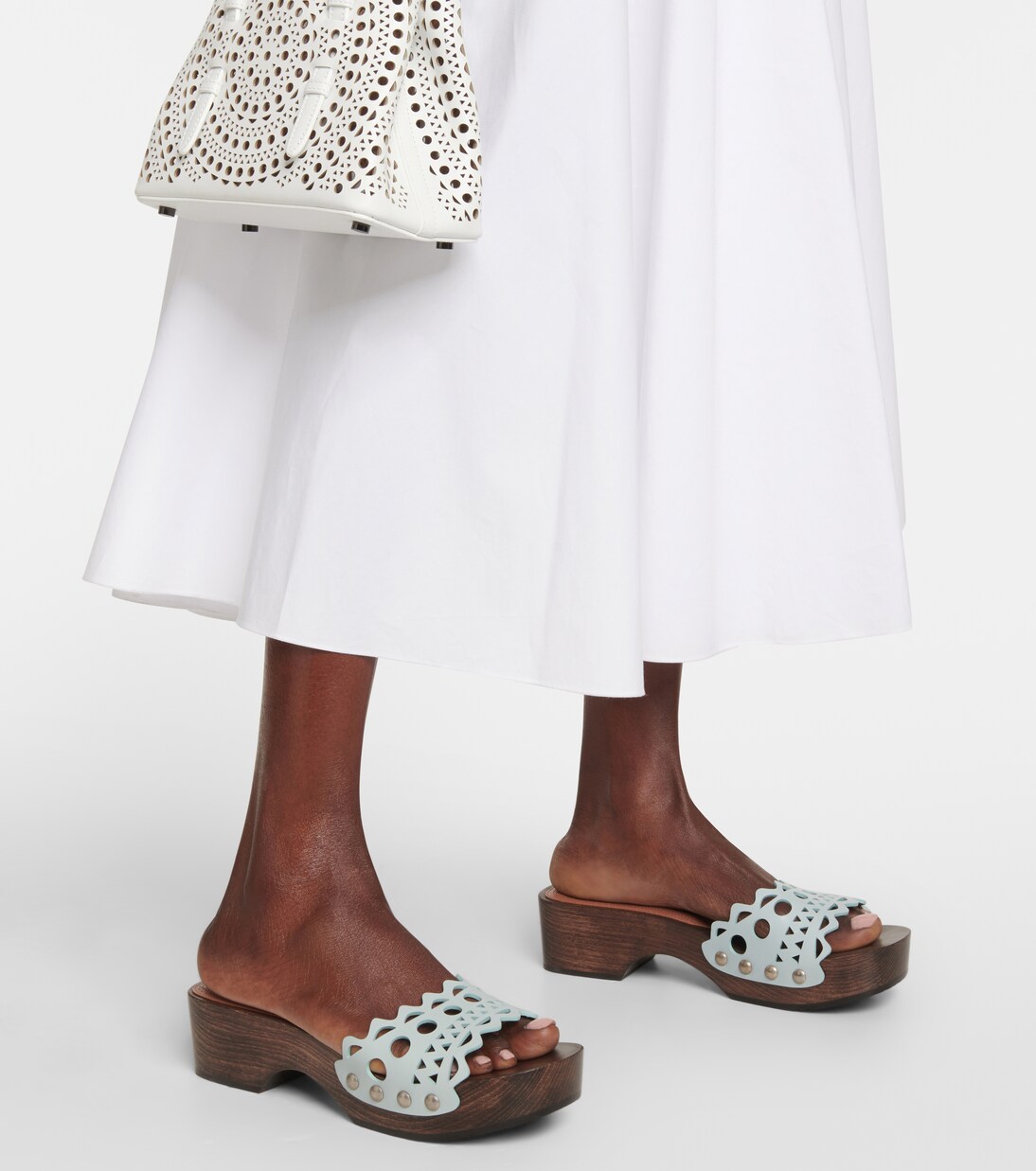 Vienne leather and wood slides in green - Alaia | Mytheresa