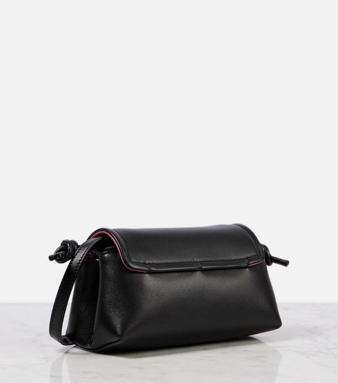 Black Leather Buckle Sling Crossbody Bag by Valentino Garavani main image 1