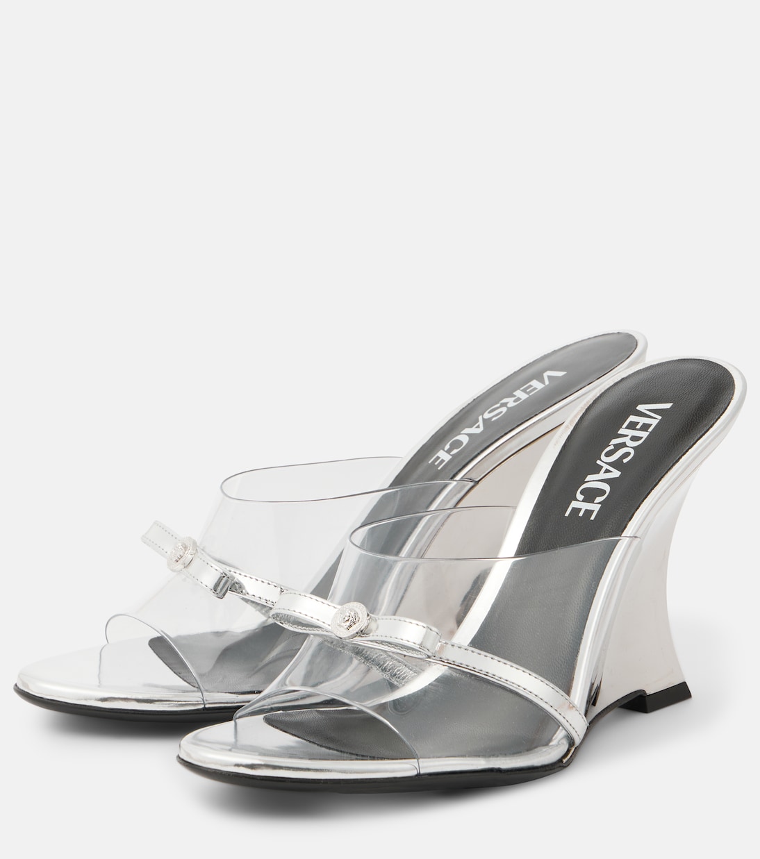 Gianni Ribbon 95 PVC wedge mules in silver - Versace | Mytheresa