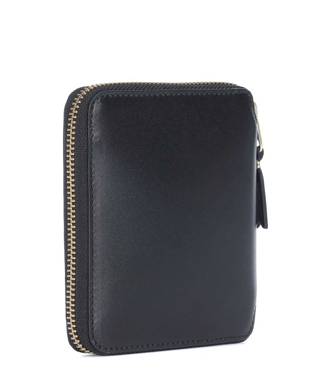 comme des garcons passport holder