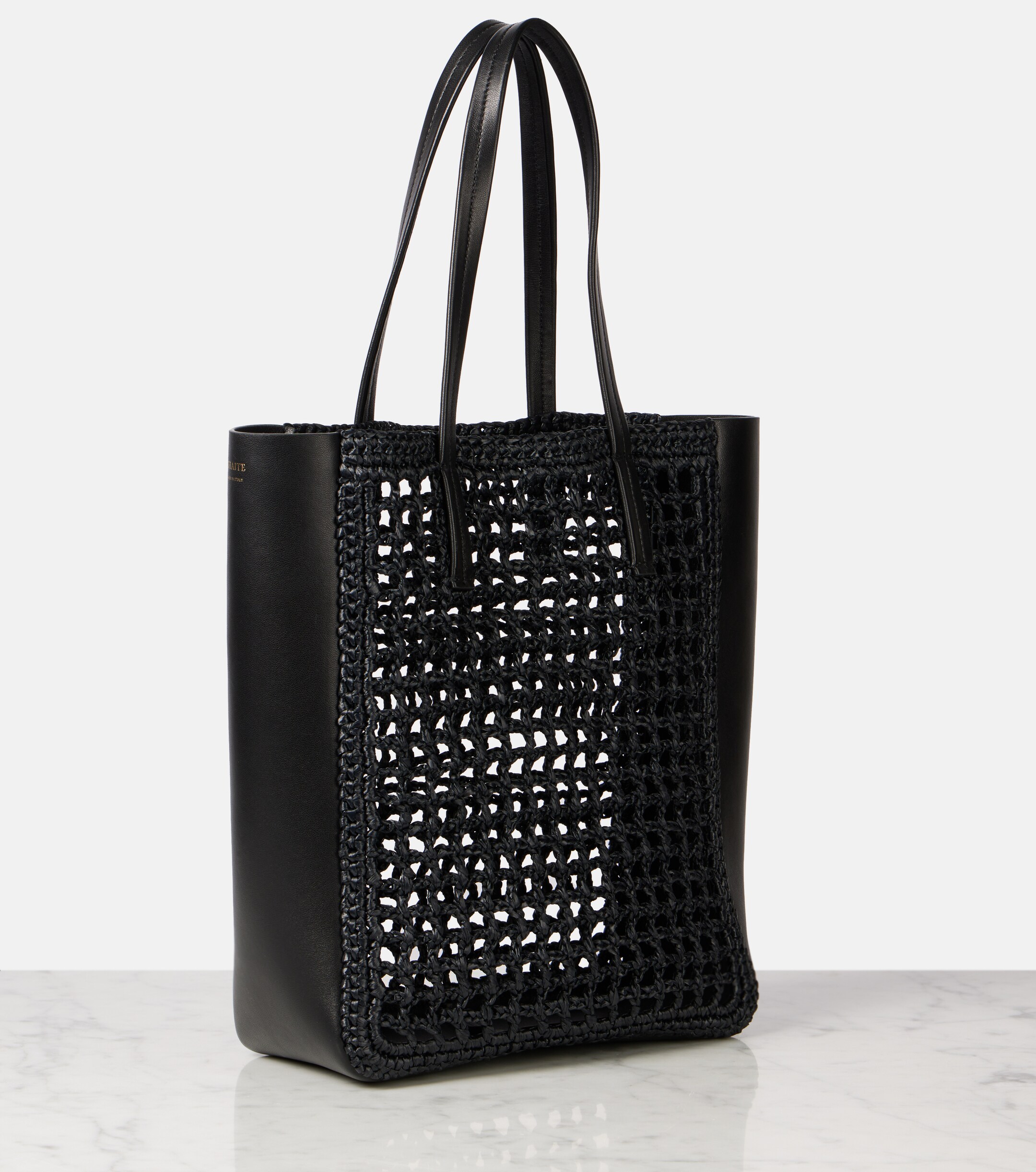 KHAITE Zoe Small leather-trimmed raffia tote bag