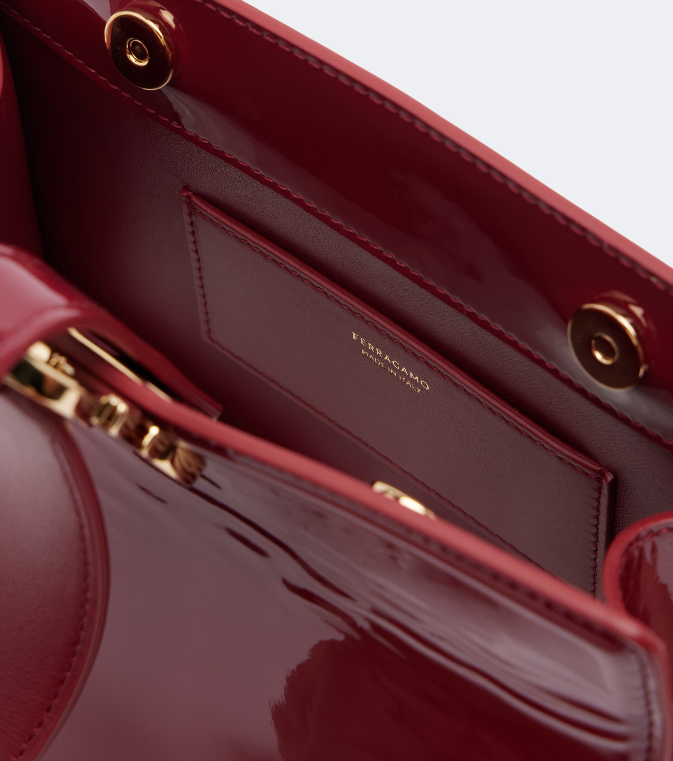 Ferragamo Ferragamo Gancini Small patent leather clutch