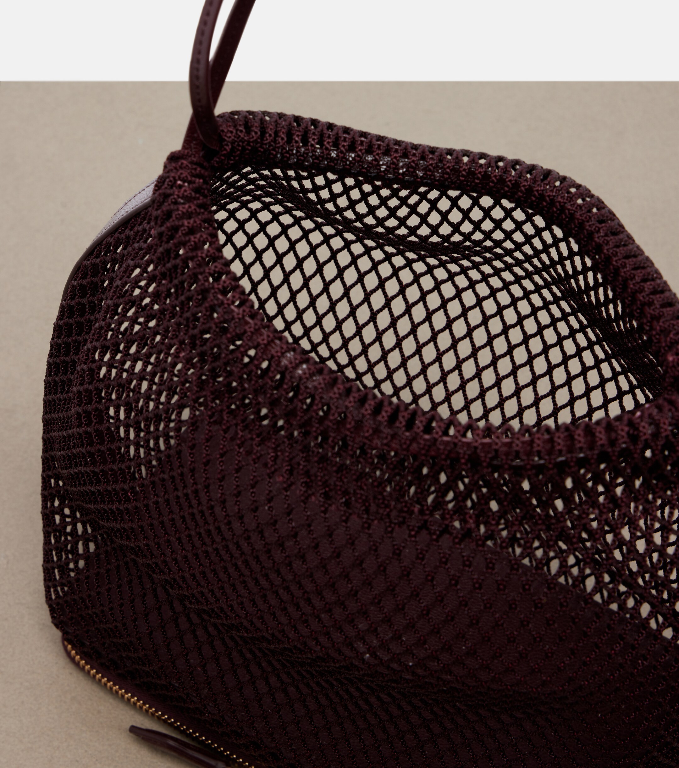 Alaïa Le Pochon fishnet bucket bag