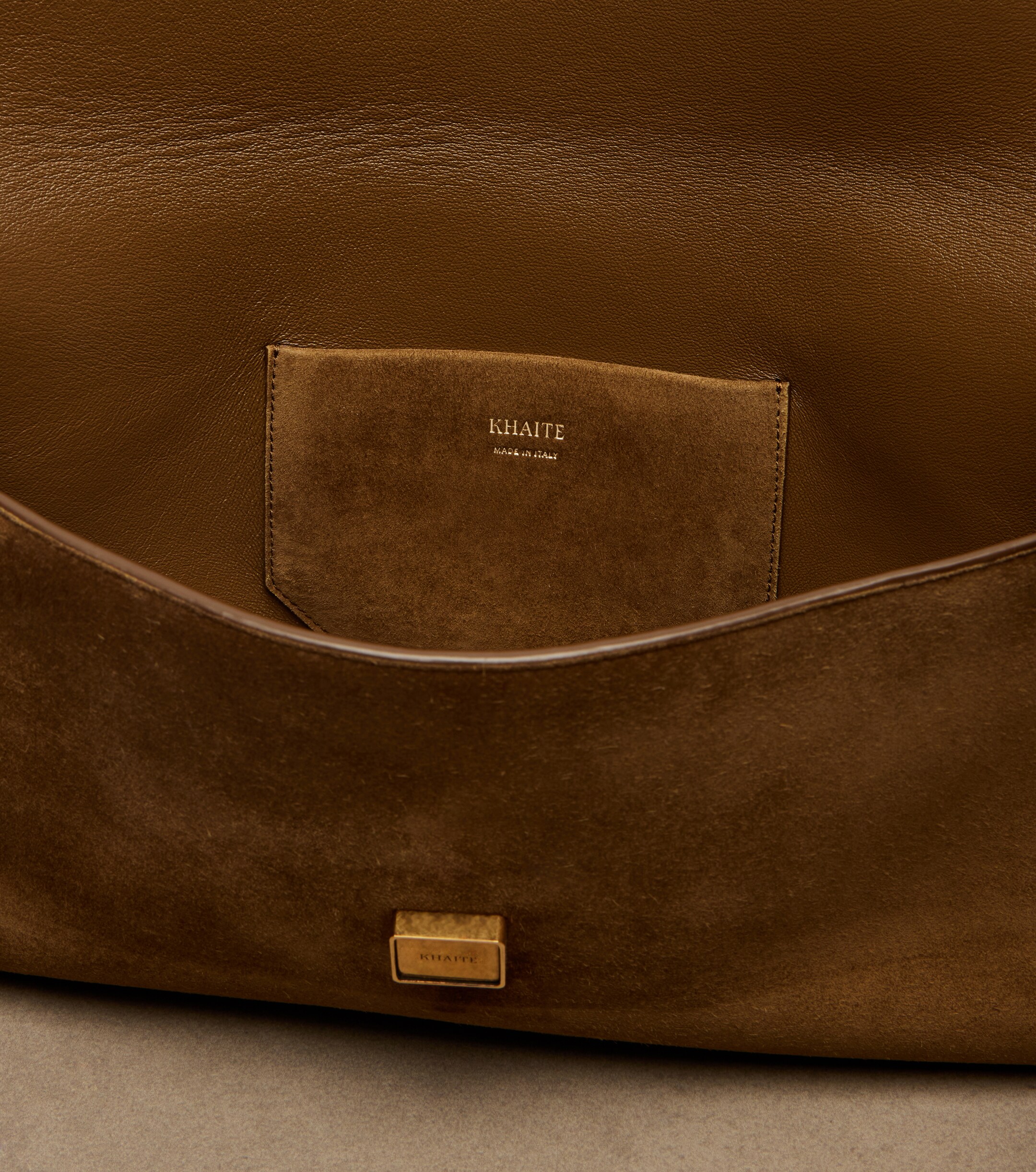 KHAITE Audrey suede clutch