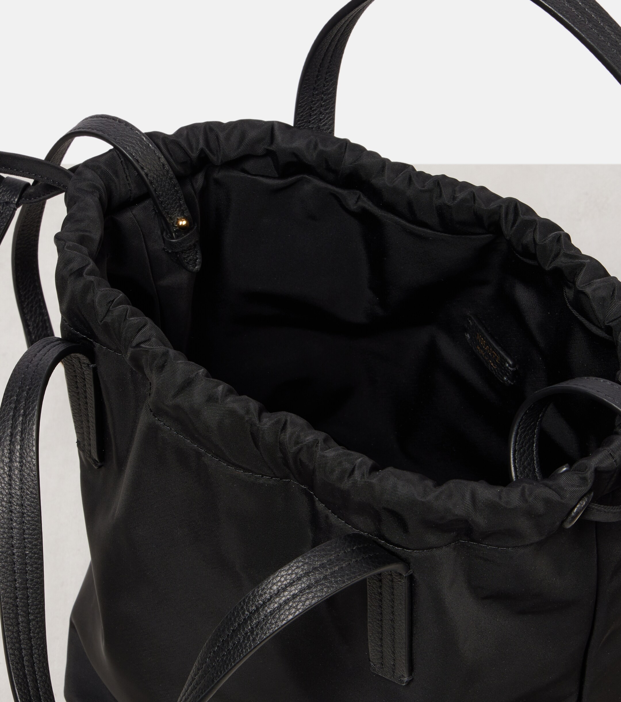 KHAITE Rory Medium leather-trimmed bucket bag