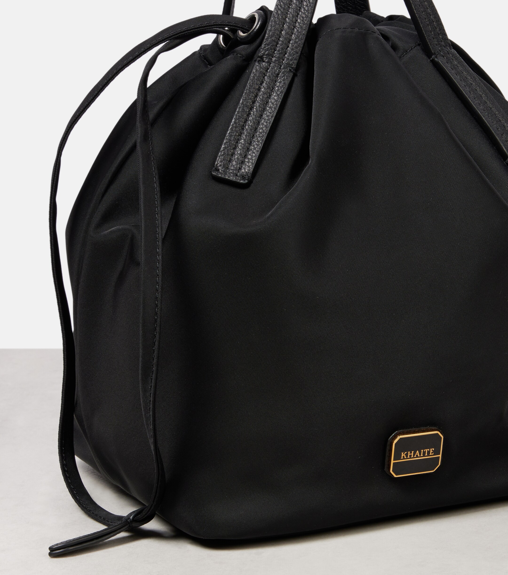 KHAITE Rory Medium leather-trimmed bucket bag