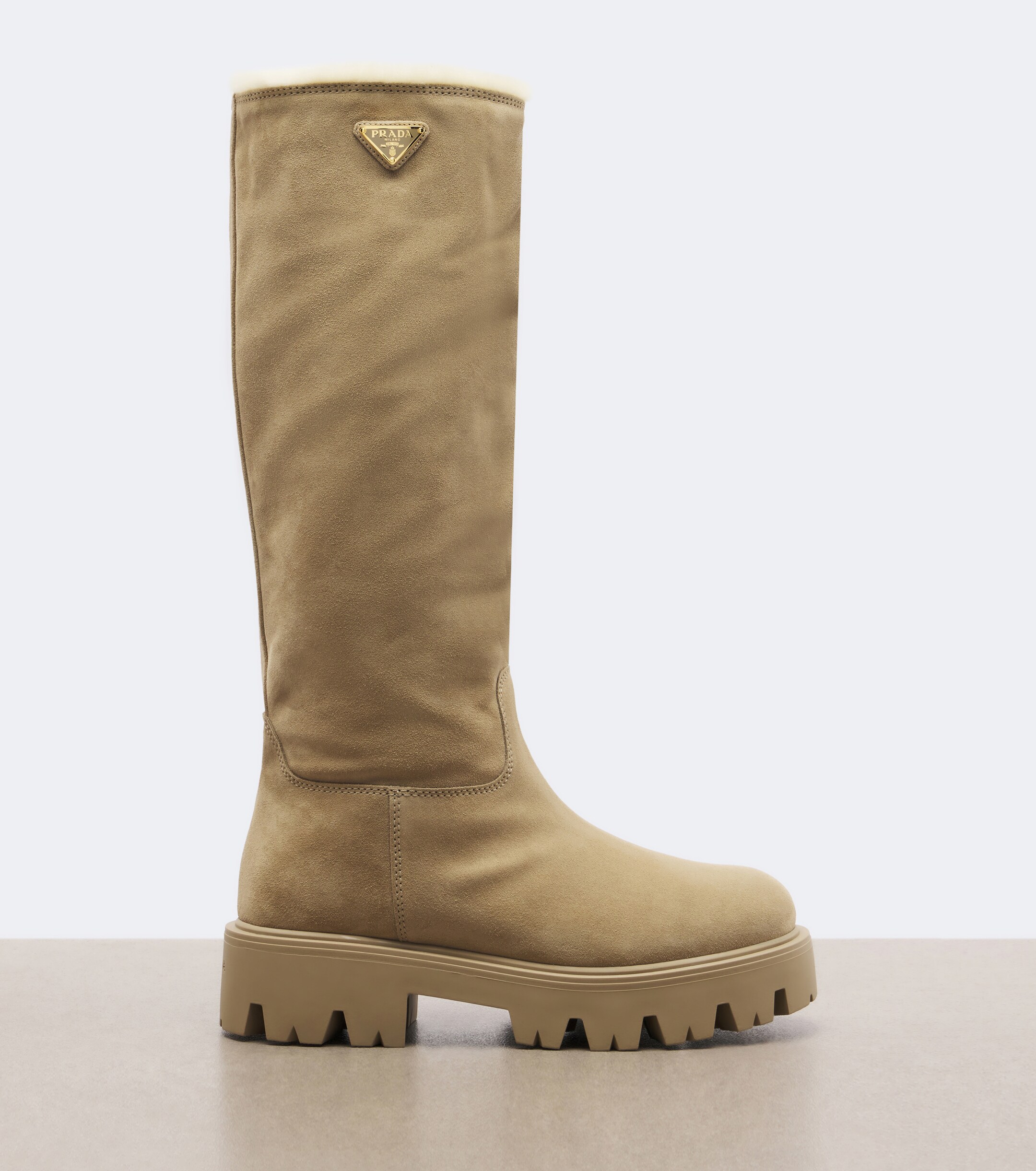 Prada Prada Shearling-lined suede knee-high boots