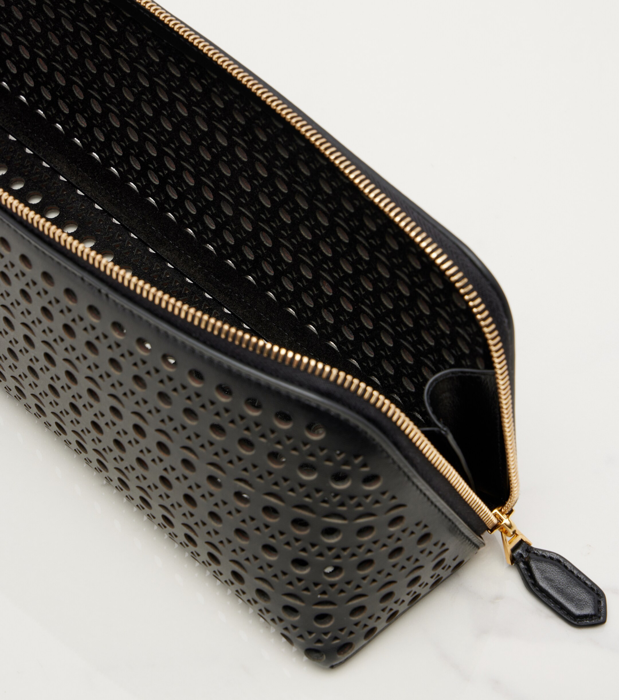 Alaïa Delta Small leather clutch