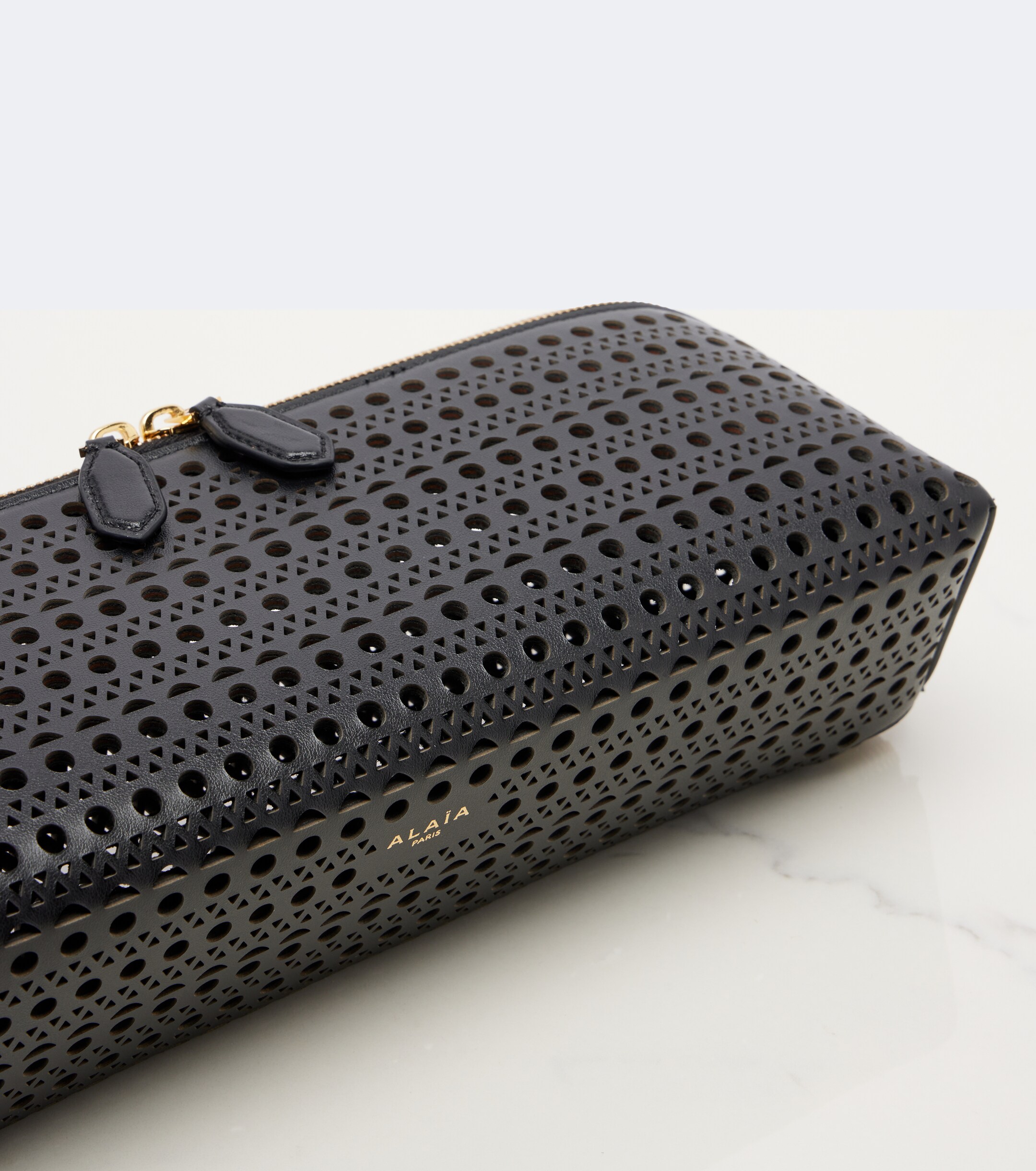 Alaïa Delta Small leather clutch