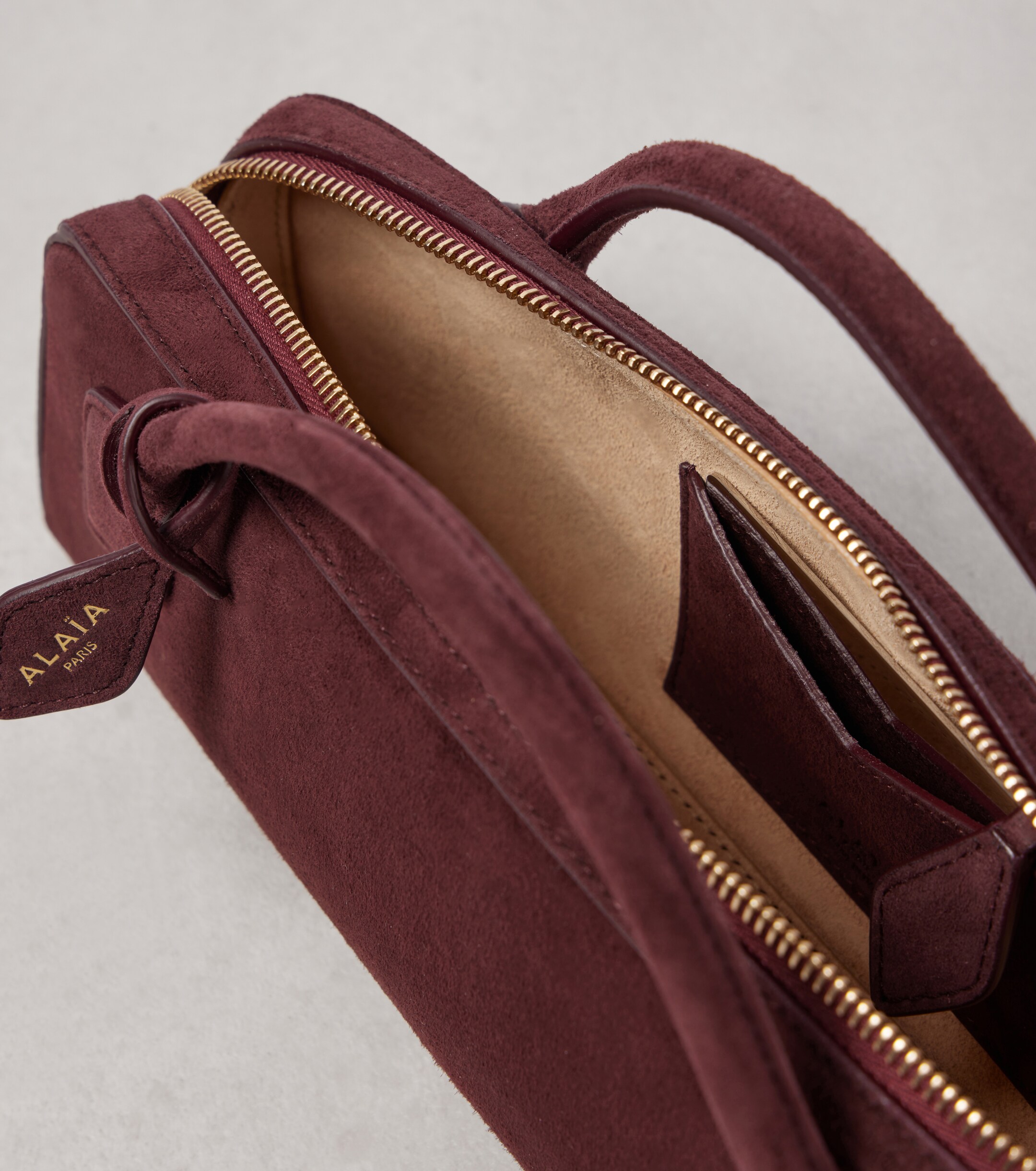 Alaïa Le Teckel suede top-handle bag