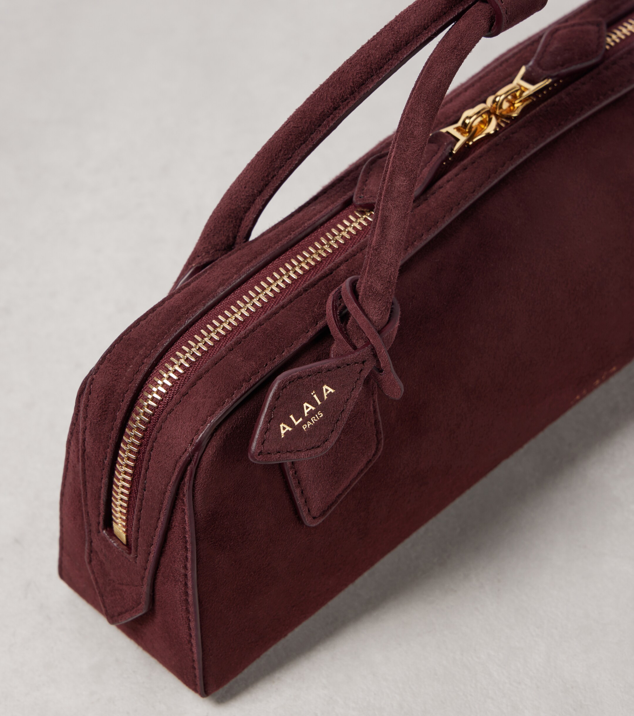 Alaïa Le Teckel suede top-handle bag