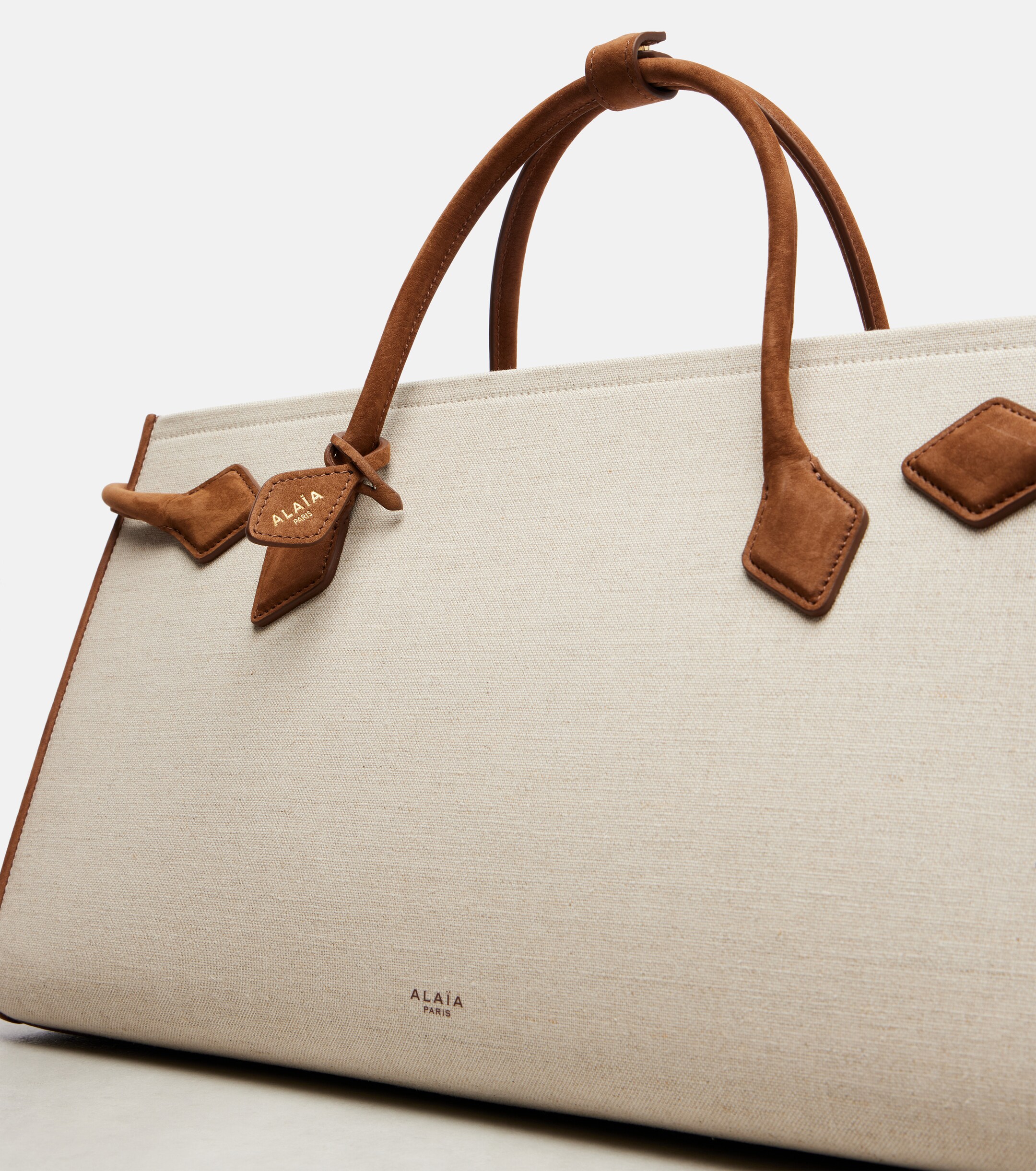 Alaïa Le Teckel leather-trimmed canvas tote bag